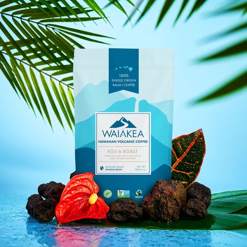 Waiakea Hawaiian volcanic coffee Kona roast package with tropical leaves and rocks