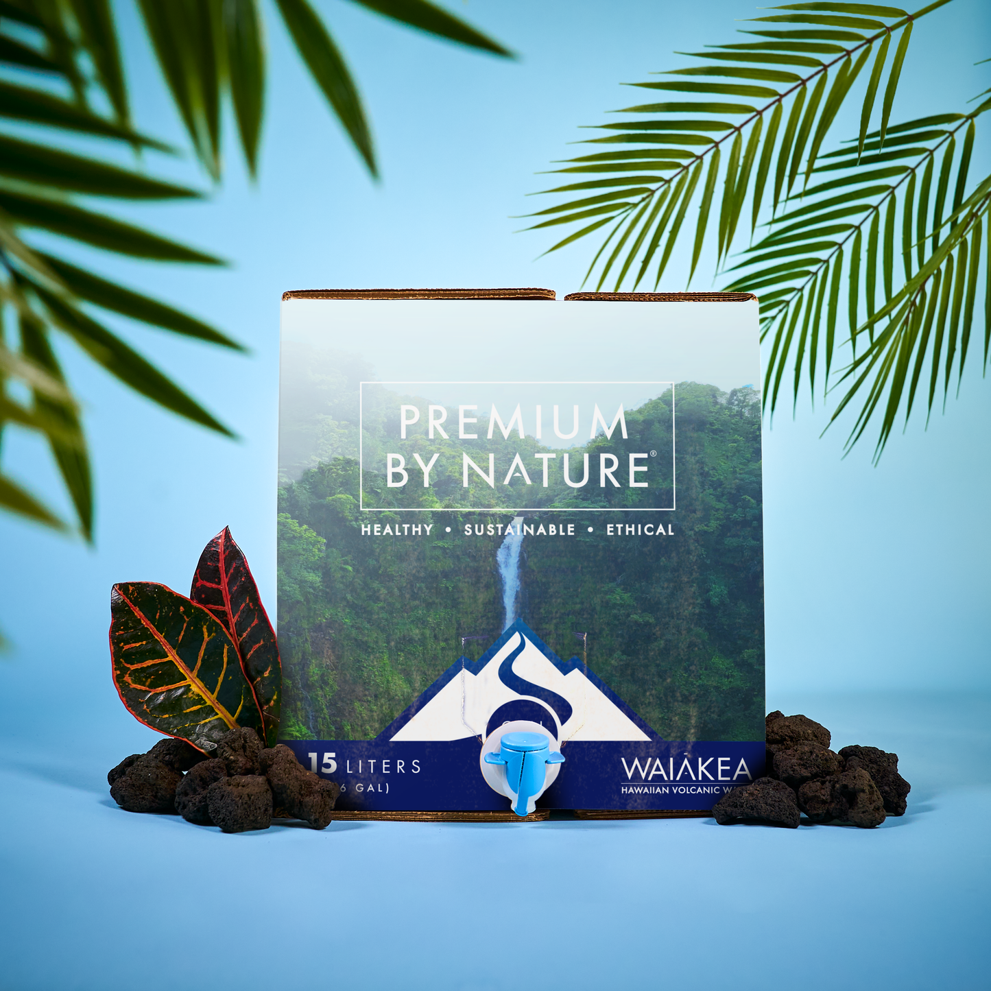 Waiakea Hawaiian volcanic water packaging with foliage and rocks