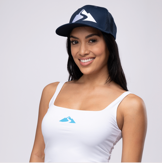 woman wearing baseball hat with Waiākea logo on front