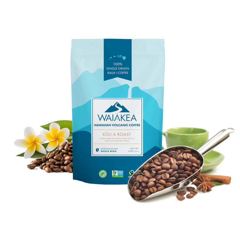 Waiakea Hawaiian volcanic coffee bag with coffee beans and plumeria flowers