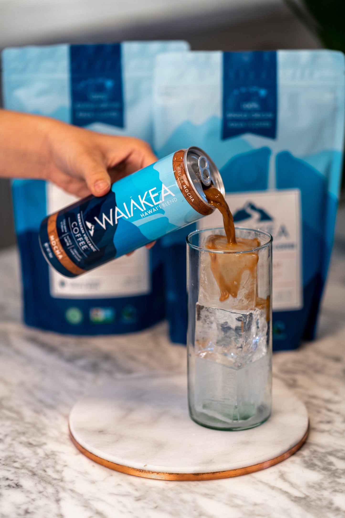 Waiakea Hawaiian coffee can pouring over ice