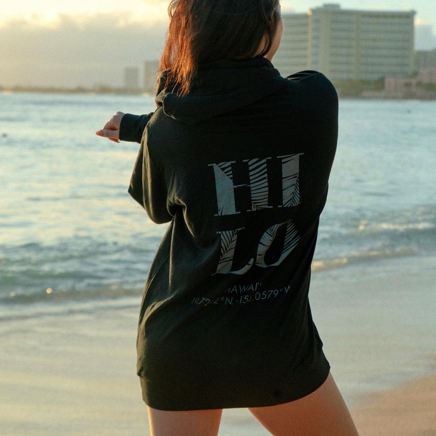 "woman beach hoodie Hilo Hawaii ocean"