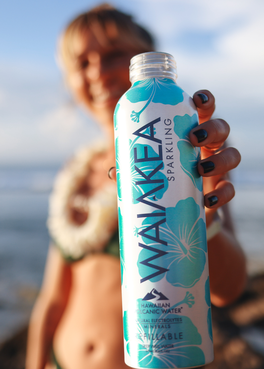 Waiakea Hawaiian volcanic water bottle beach background