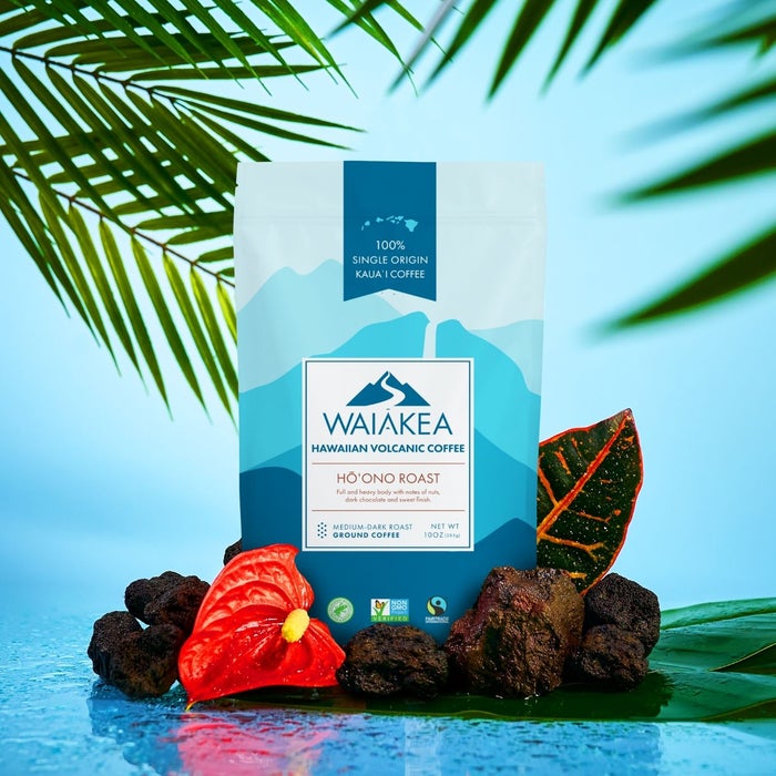 Waiakea Hawaiian volcanic coffee packaging with tropical leaves and rocks.