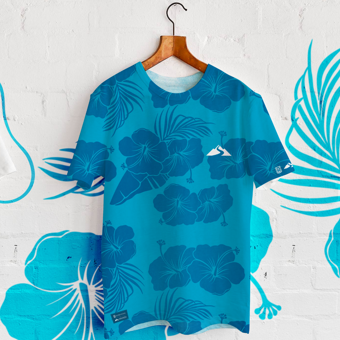 "blue floral patterned t-shirt hanging on wall"