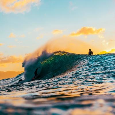 A surfer preparing to ride a collapsing wave