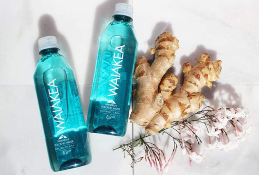 Waiakea bottles next to ginger root