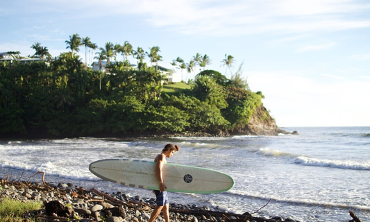 Man heading out to surf