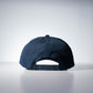 back of a navy hat with mini holes on the fabric