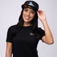 Young woman wearing black t-shirt and cap smiling