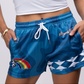 Blue graphic shorts with rainbow and thankful design.