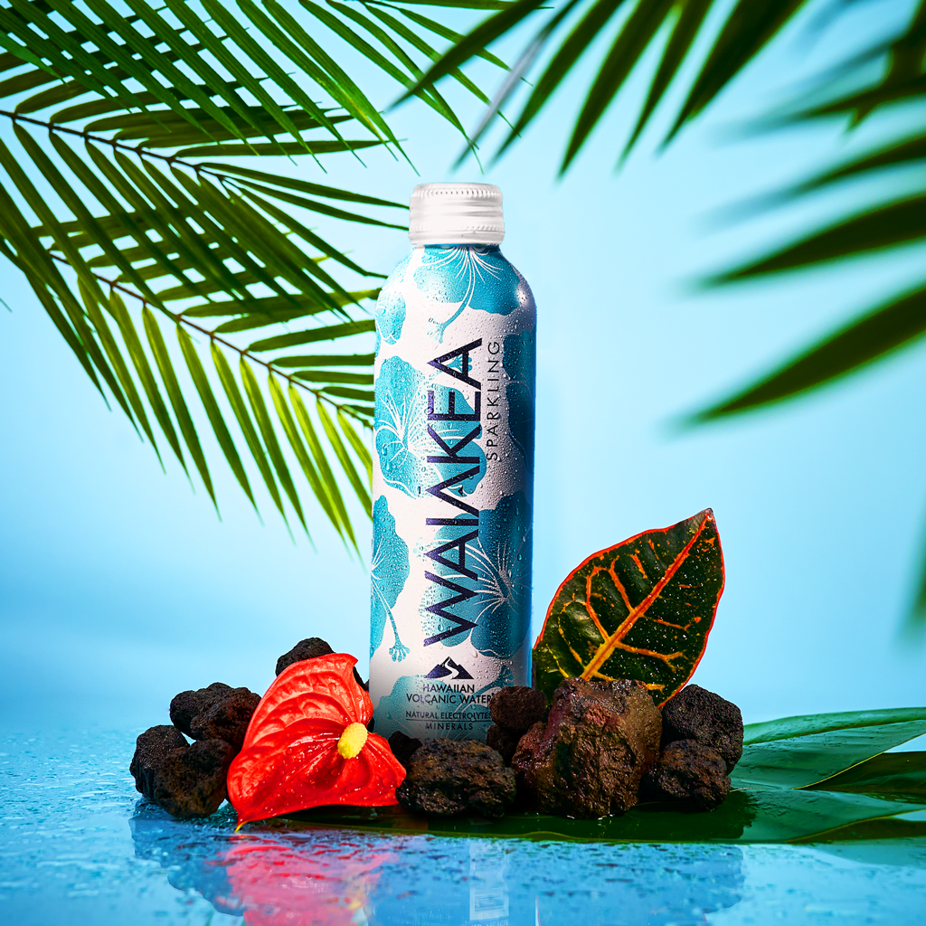 Waiakea Hawaiian volcanic water bottle with tropical leaves and rocks